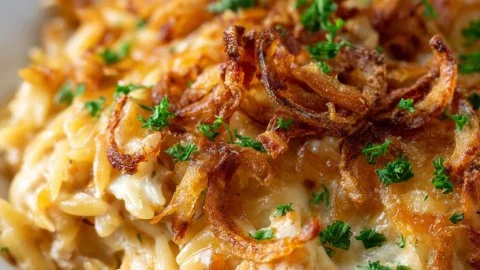 Delicious French Onion Chicken Orzo Casserole garnished with herbs