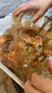 Delicious bag-cooked chicken with vibrant vegetables ready to serve.