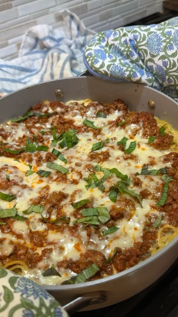 Baked Cowboy Butter Spaghetti served in a bowl with fresh herbs and cheese