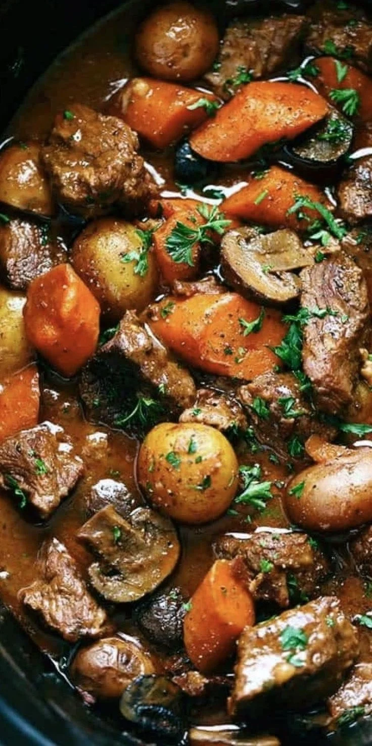 Delicious homemade beef stew with tender meat and fresh vegetables in a bowl.