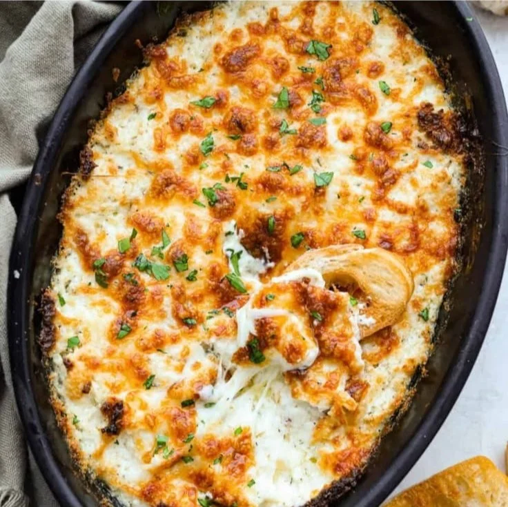 Creamy cheese dip served in a bowl with tortilla chips