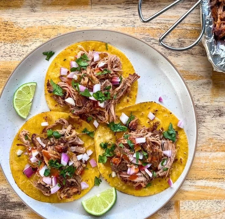 Delicious Crockpot Pulled Pork Carnitas served in a bowl with toppings