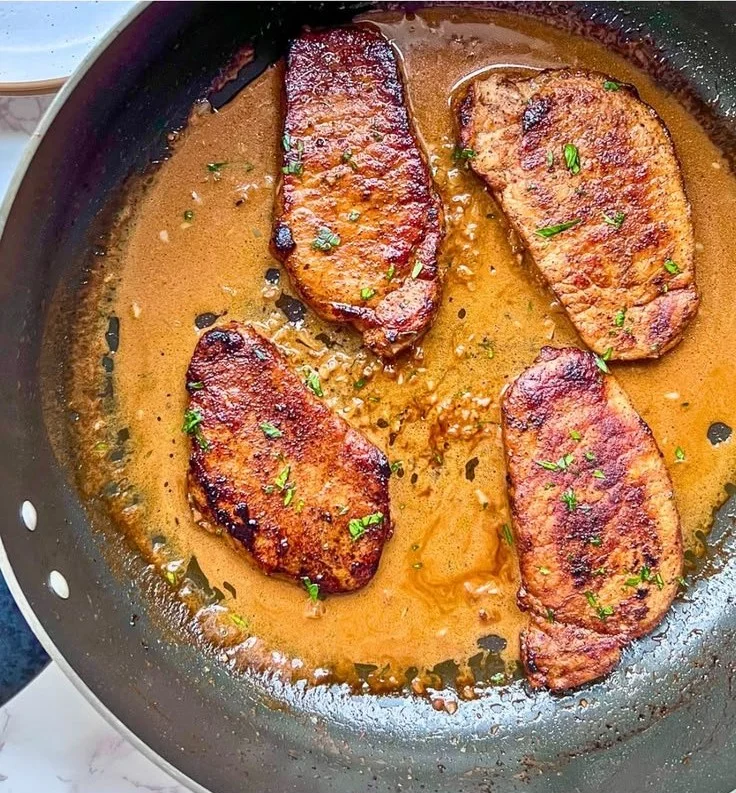 Espresso Rubbed Pork Chops cooked to perfection on a plate