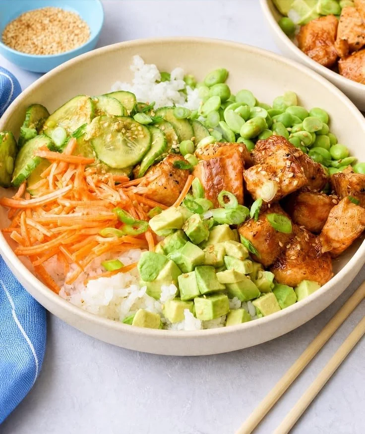 Delicious glazed salmon bowl with vegetables and rice