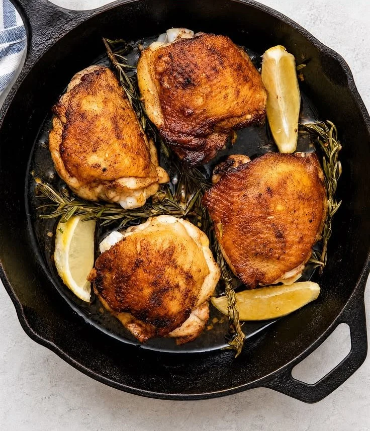 Delicious Lemon Garlic Rosemary Chicken Thighs served on a plate.