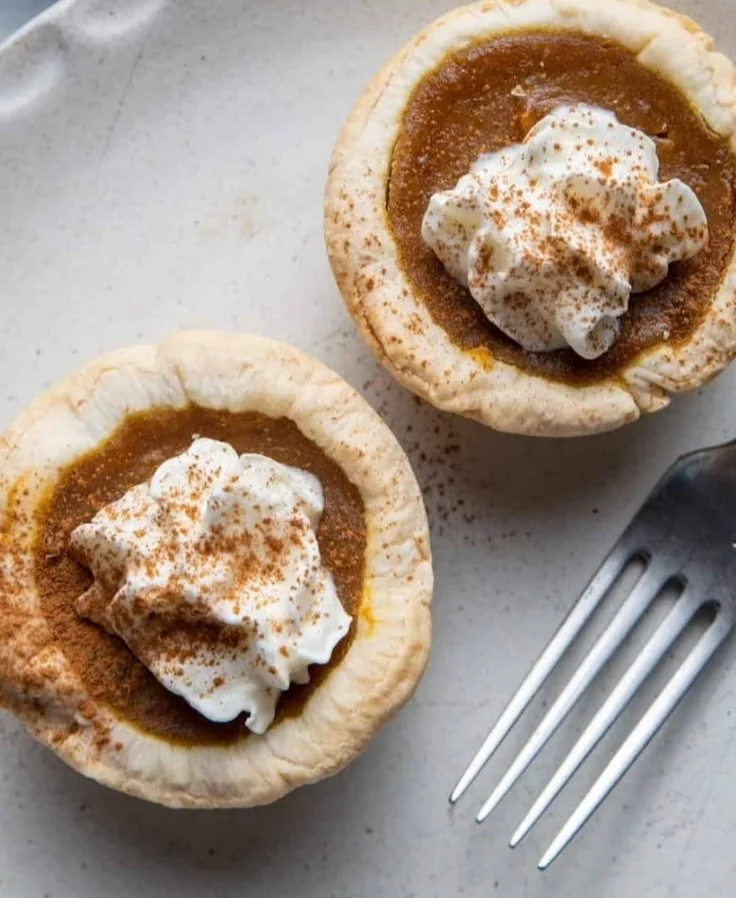 Delicious mini pumpkin pies displayed on a festive table