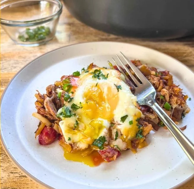 Delicious Pulled Pork Breakfast Skillet served with eggs and veggies