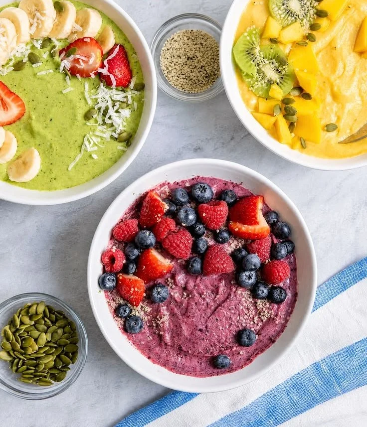 Colorful and nutritious smoothie bowls topped with fruits and seeds