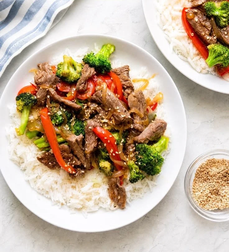Teriyaki flank steak with broccoli served on a plate