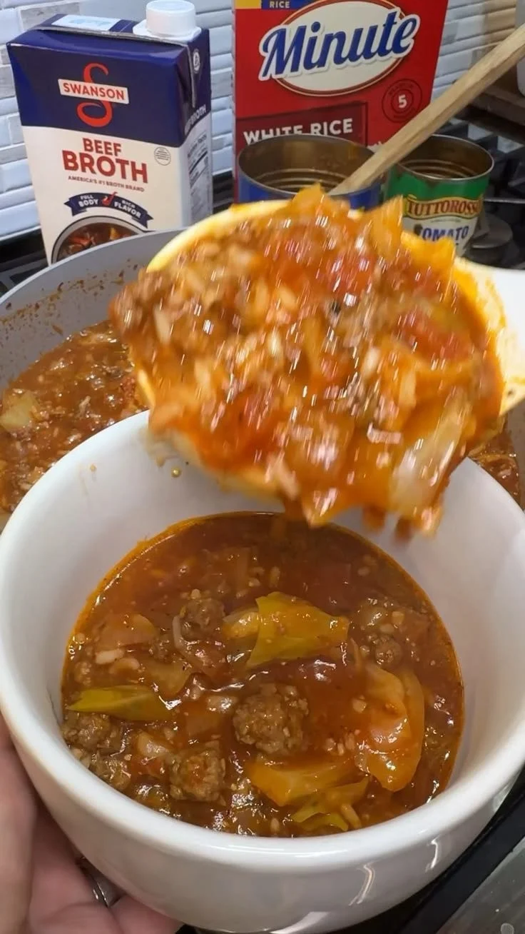 Delicious bowl of unstuffed cabbage roll soup garnished with herbs
